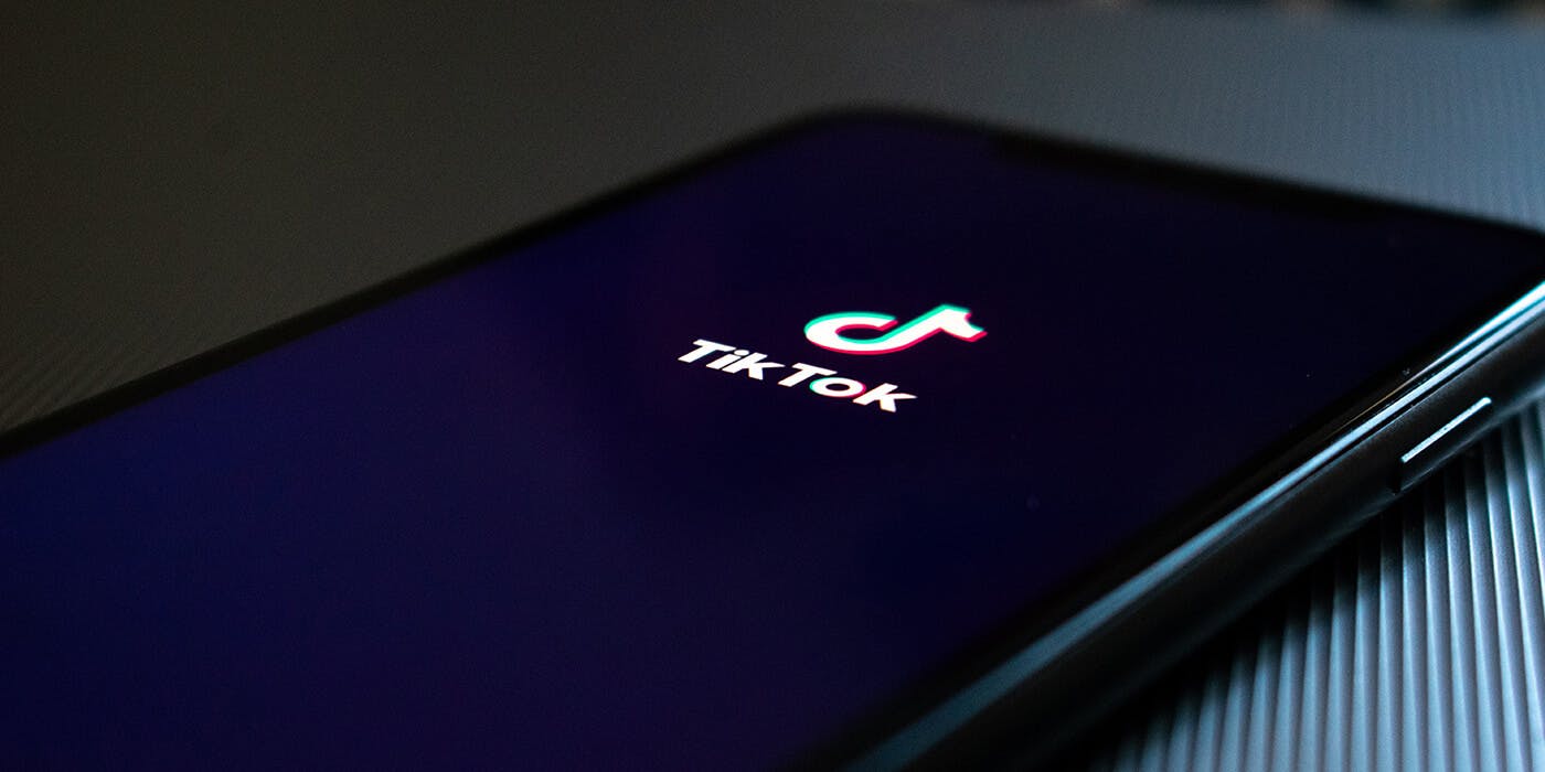 Tiktok logo on a black background. This is the splash screen shown when the app starts on a mobile device.